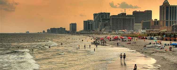 Atlantic City, New Jersey, beach and skyline at sunset